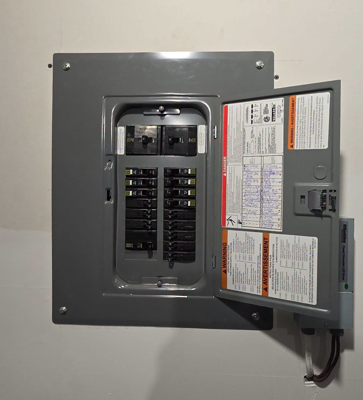 An open residential load centre with breakers labelled and the circuit directory filled in, installed on a Yarmouth County home.