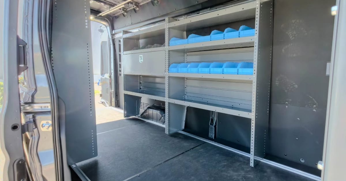 The inside of the service van, shelved and stocked with fittings, devices and terminations.